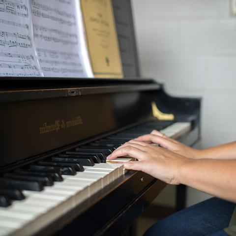 Student playing the piano